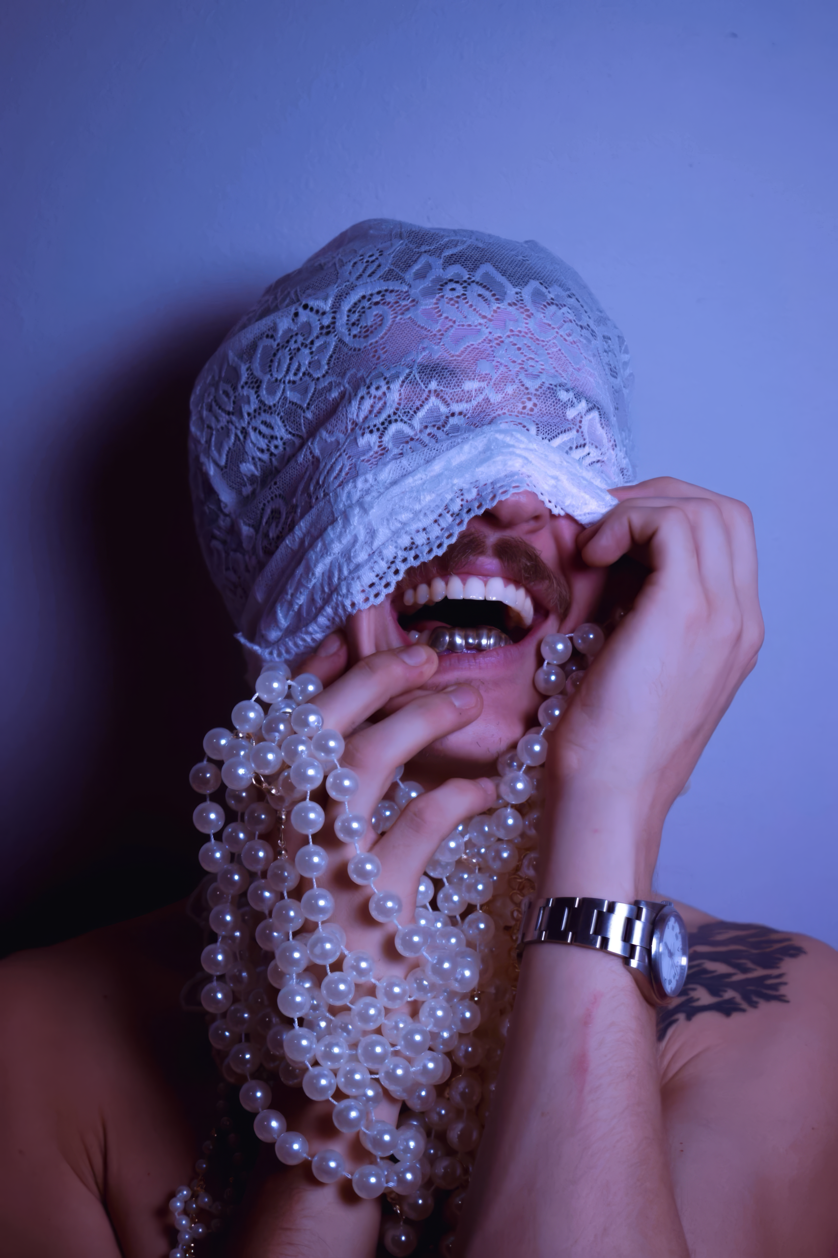 Close up portrait of SNUGG in a lace veil